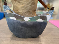Sac demi-lune à géométrie variable